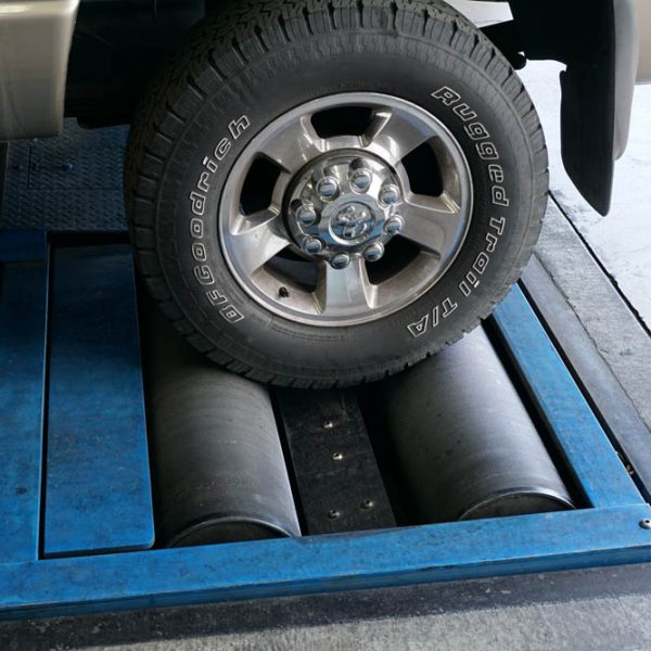 A car getting fixed at The Muffler Shop