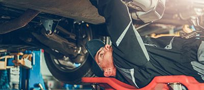 A mechanic fixing a car