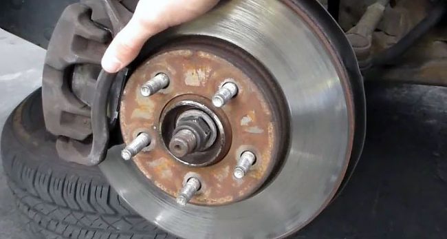Someone holding wheel bearings